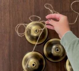 Create a layered effect by tying twine to the Christmas bells