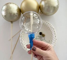 how to make matte ornaments, Taping the ornaments to skewers