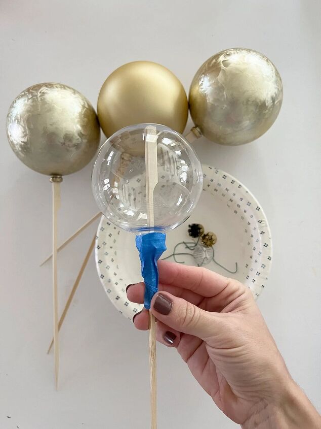 how to make matte ornaments, Taping the ornaments to skewers