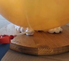 Applying expanding foam between the ball and base