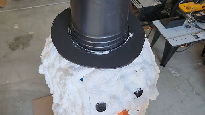 Attach the hat to the snowman's head