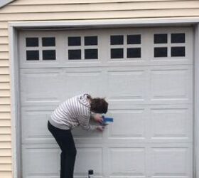 make your garage door look like it costs thousands with paint, Applying painter s tape around the handle