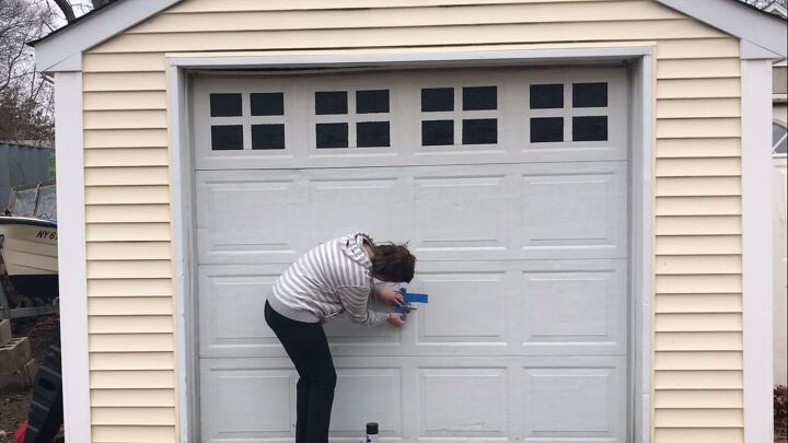 make your garage door look like it costs thousands with paint, Applying painter s tape around the handle