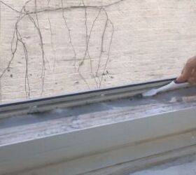 pour vinegar into your windowsill for an easy cleaning hack, Scrubbing the mold with a toothbrush