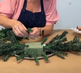Sticking the branches into the foam