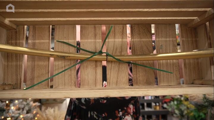 Attaching the hoop to the crate with zip ties