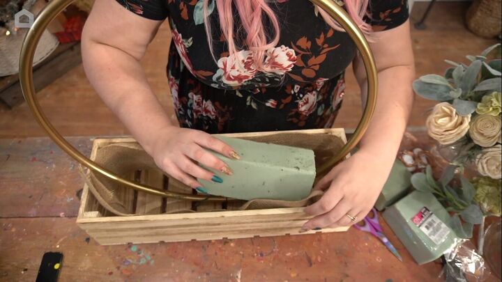 Placing floral foam bricks inside the crate