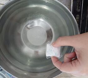Drop a dishwasher pod in hot water