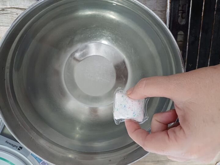 Drop a dishwasher pod in hot water