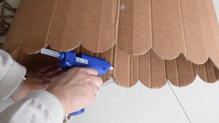 Add hot glue to the cardboard