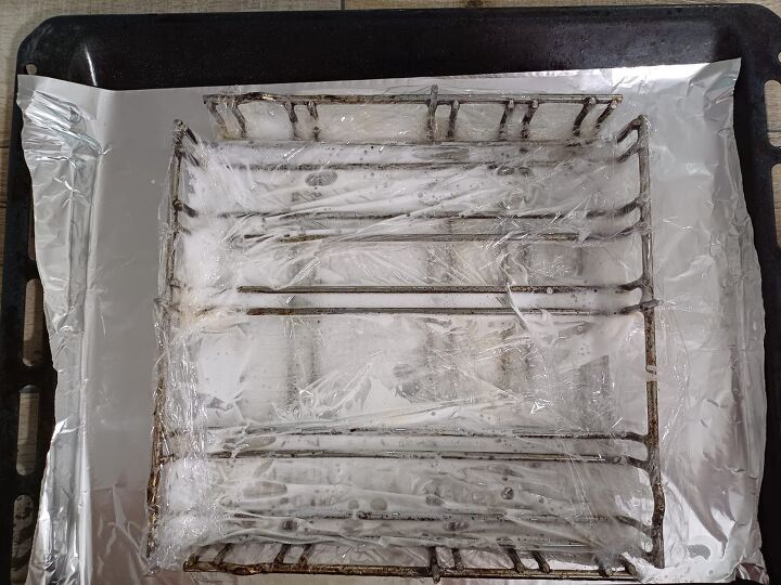 12 easy ways to make sure your oven is always spotless, Cover those racks in plastic wrap