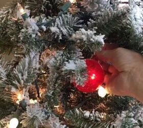 how to decorate a christmas tree, Tucking ornaments into the tree