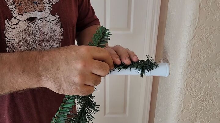 Attach a longer garland to the rod with the ties