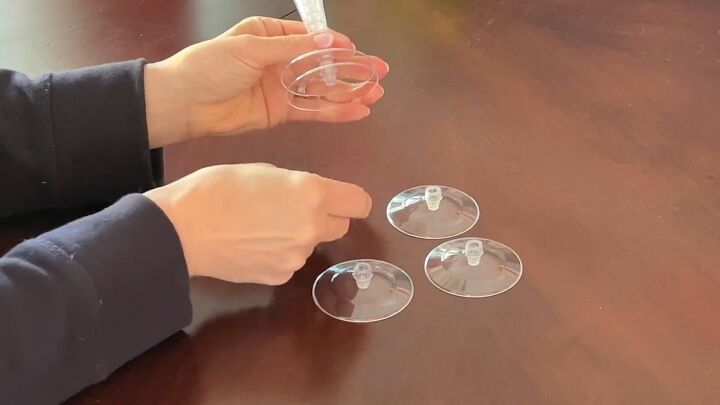 Remove the bottoms of the plastic glasses