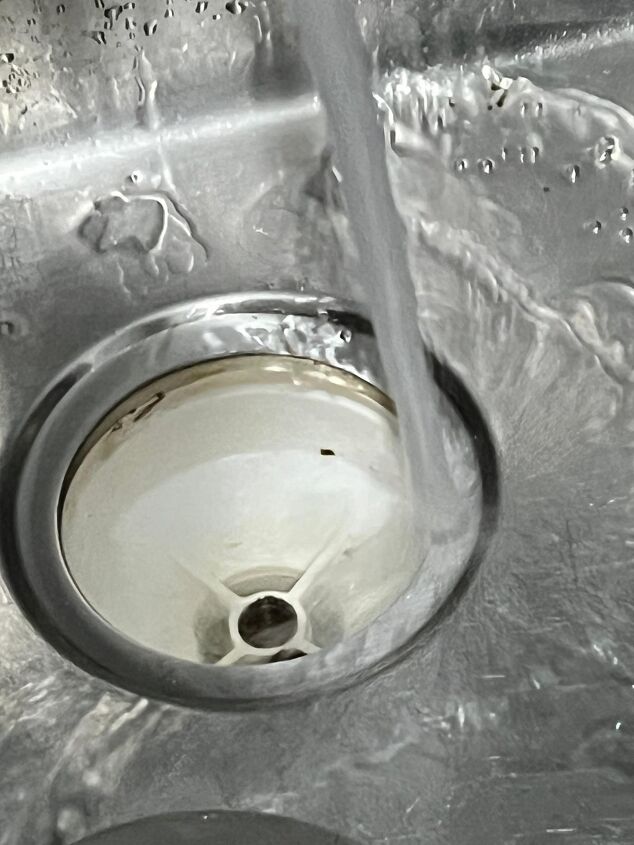 How to remove gunk from sink strainer