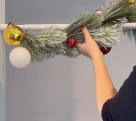 how to hang a garland, Wrapping the garland around the tension rod