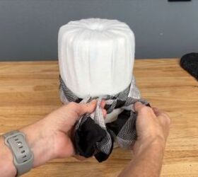 Tie a scarf around the snowman