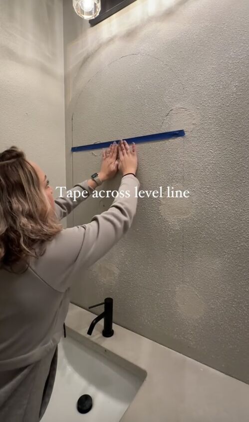 how to hang mirror on wall, Placing tape across the level line