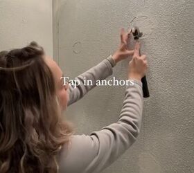 how to hang mirror on wall, Tapping in the anchors