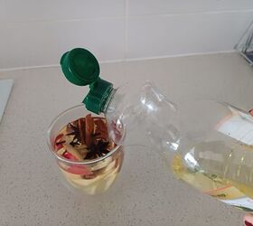 She puts fruit slices and spices into a cup and covers them with oil for this free trick