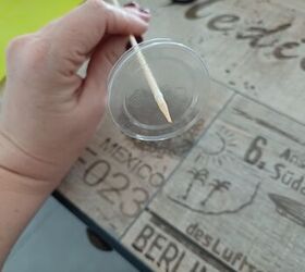 Bottom of plastic cup with skewer in the middle