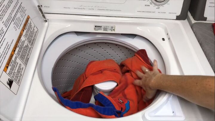 Placing towels in the washing machine