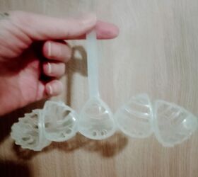 Instead of buying a new toilet rim block, she opens up an empty one and does THIS