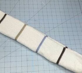 She rolls Dollar Tree hand towels together for this smart idea that everyone will love