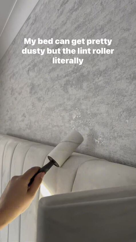 Using a lint roller on a headboard