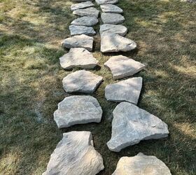 She lays 2 rows of stones across her lawn for this simple way to add instant charm to her property