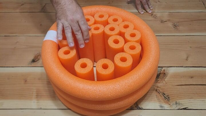 Fitting cut pool noodles inside the rings
