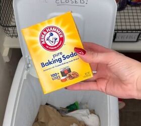 Adding baking soda to a trash can