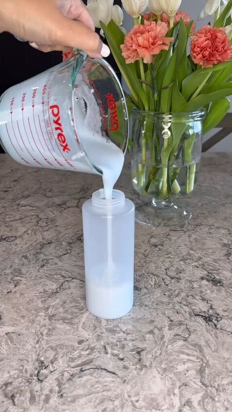 Decanting the DIY baking soda cream cleaner into a bottle