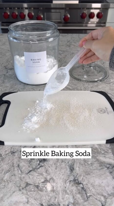 Sprinkling baking soda on the cutting board