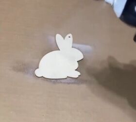 Spraying the bunny with adhesive