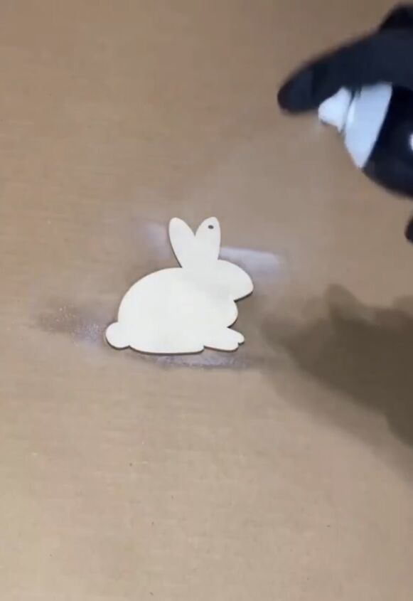 Spraying the bunny with adhesive