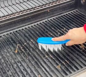 Grill grates being scrubbed clean