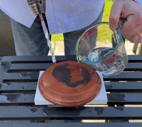 Creating holes for water flow in the terracotta pots and saucers