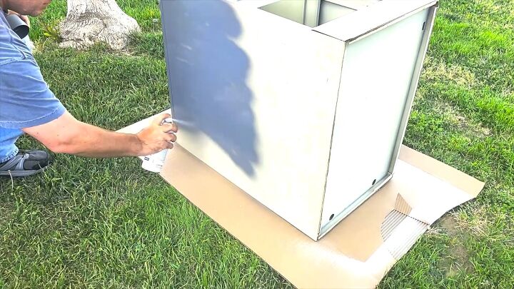 Priming the cabinet with gray primer