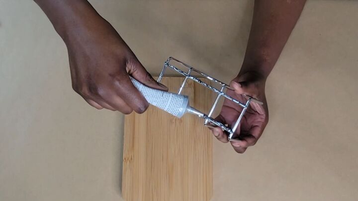 Applying glue to the metal bars of a napkin holder