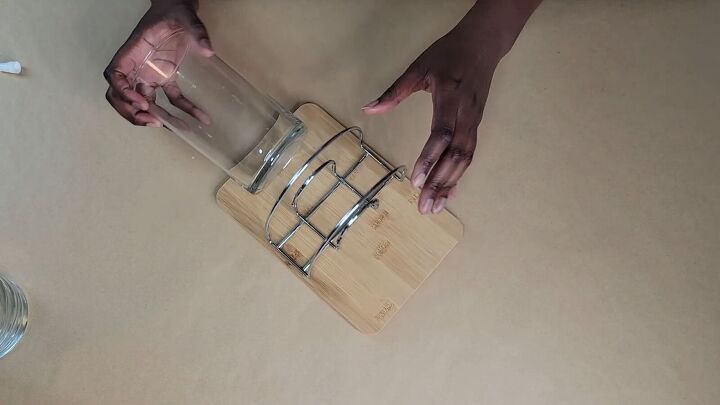 Stick a glass container on either side of the napkin holder