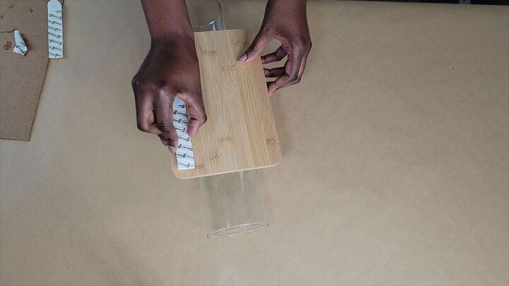 Secure the wall adhesive strips to the back