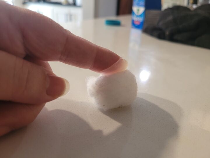 Rubbing Vicks on a cotton ball