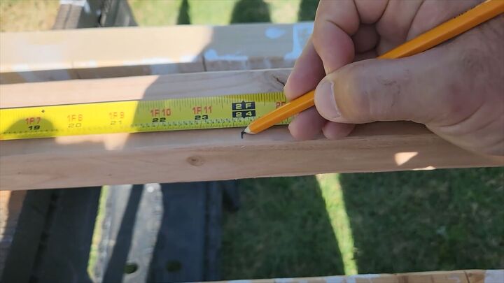 Measuring for cutting the lumber.