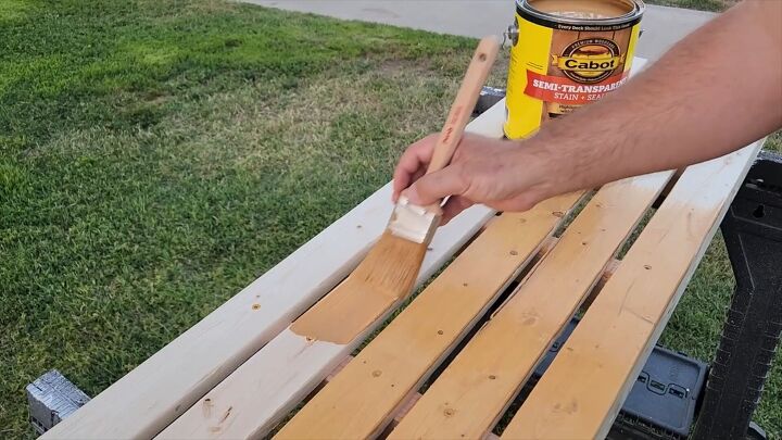 Applying Cabot Semi-Transparent Stain & Sealer to the bench.
