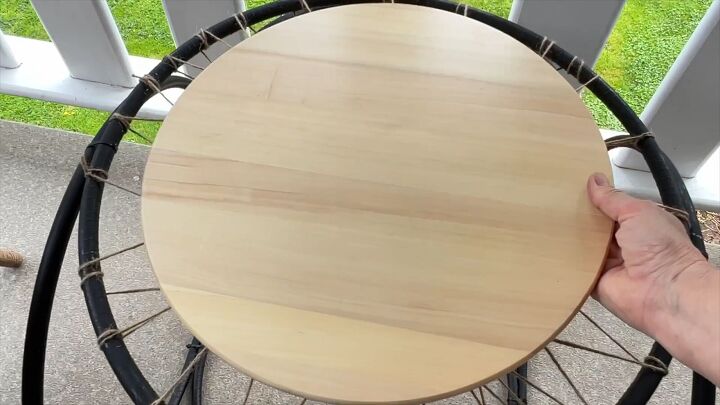 Place the wood round on top to complete your cheap DIY table