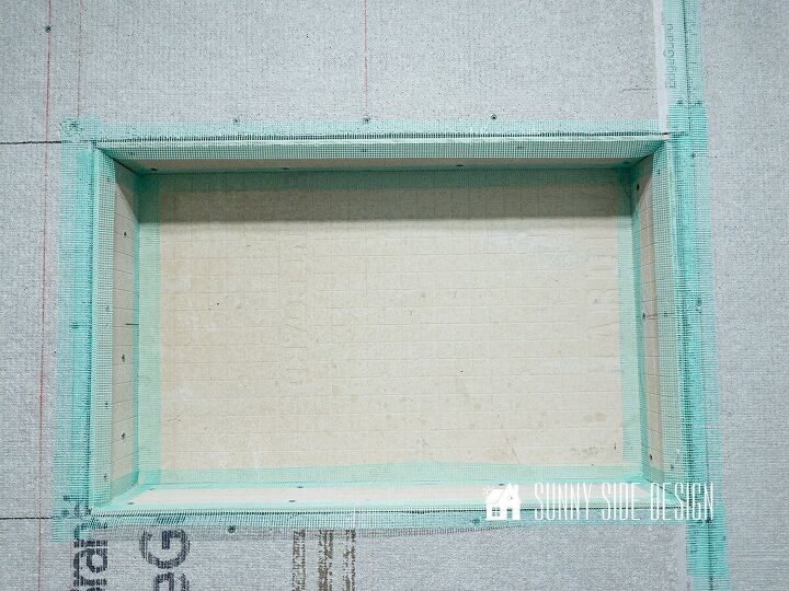 Mold and mildew resistant mesh is applied to all of the niche seams