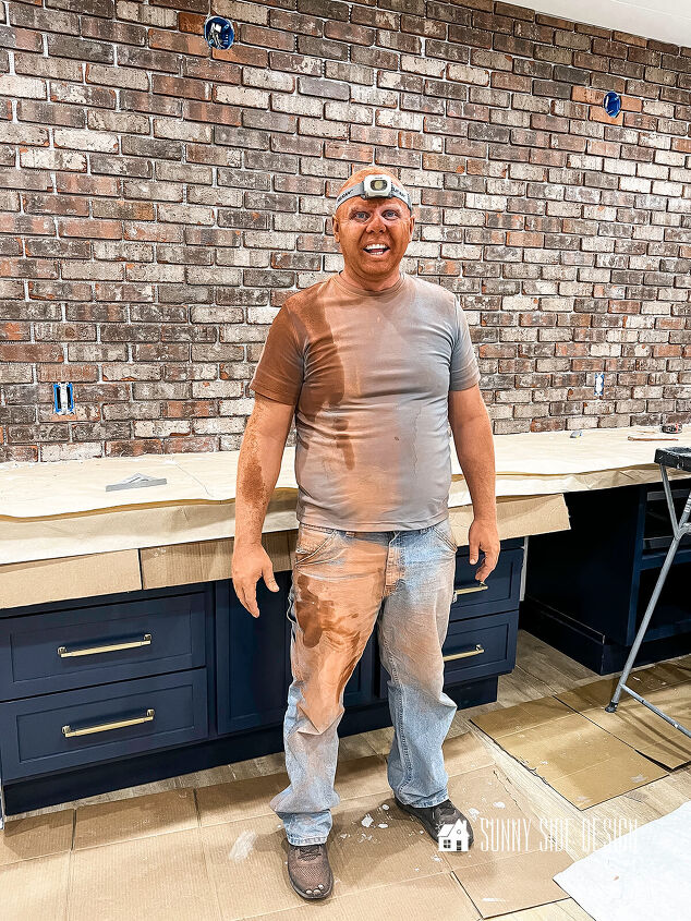 Man covered in overspray from the tile saw