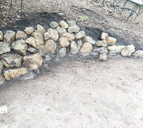 Stone retaining wall almost complete just a few gaps that need to be filled in