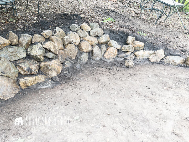 Stone retaining wall almost complete just a few gaps that need to be filled in
